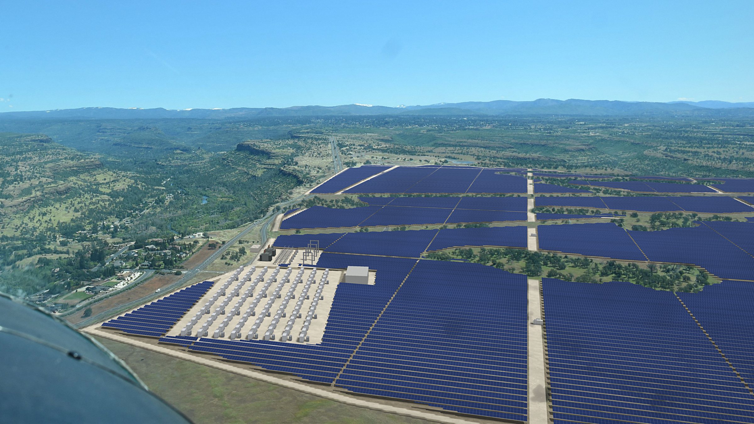 The same view with the proposed solar array, battery yard and substation covering the grassland right of Skyway.