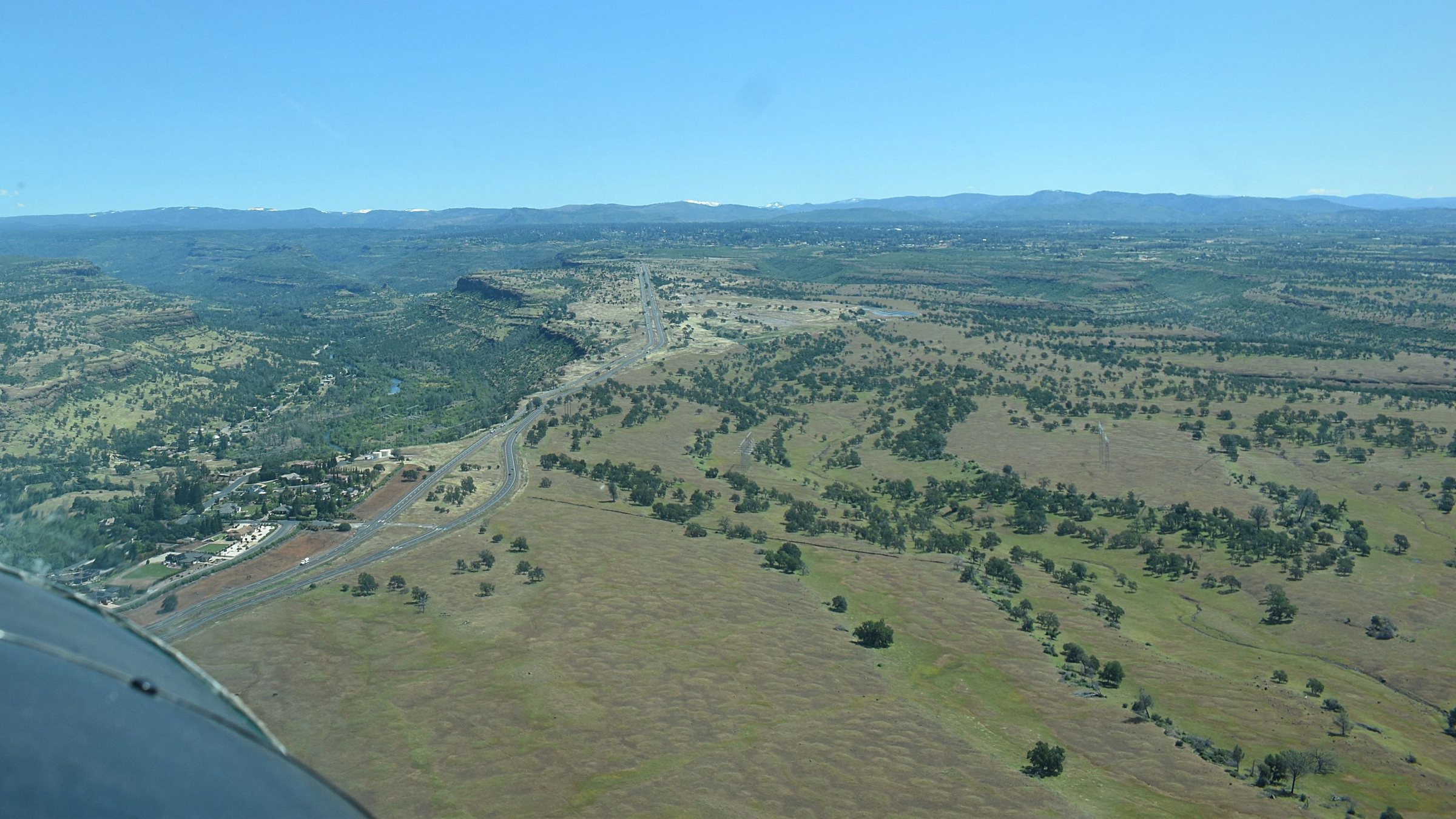 Aerial photo looking northeast up Skyway: Butte Creek Canyon on the left, open blue oak grassland on the right.